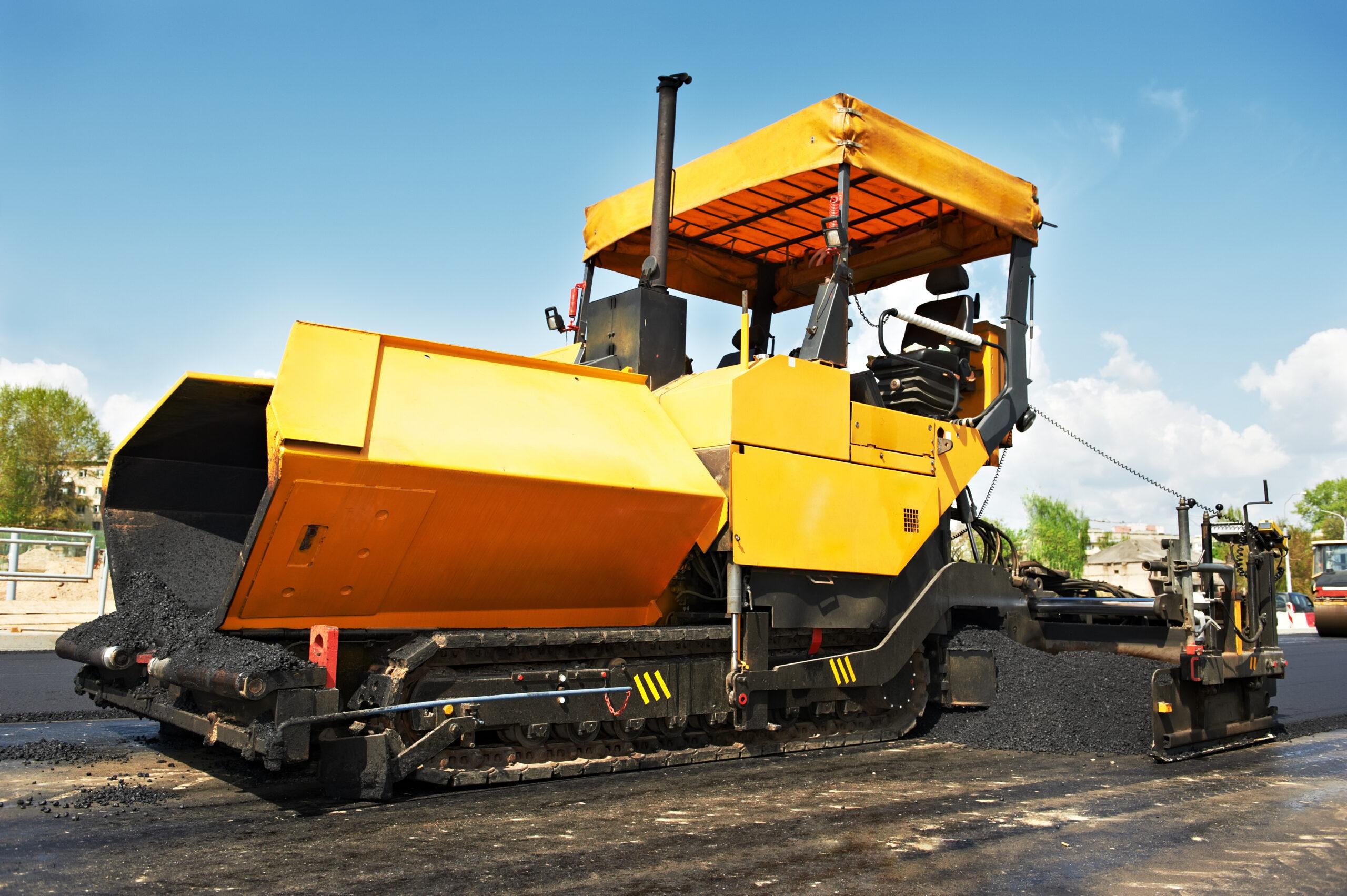 Yellow paver paving.